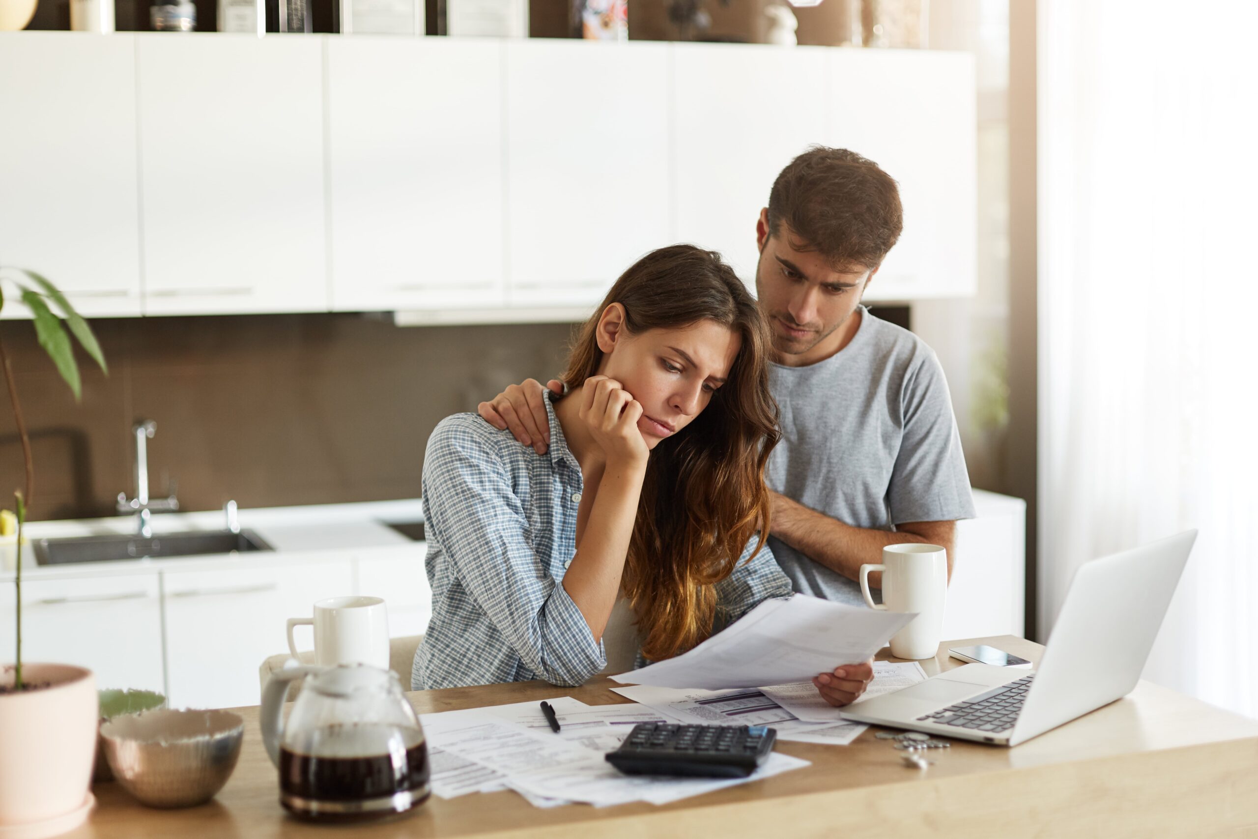 young couple checking their family budget